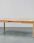 Ghost dining table twin leaf extension in oak