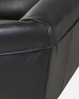 Saddle armchair in black leather