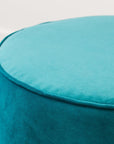 Small round ottoman in novara jungle