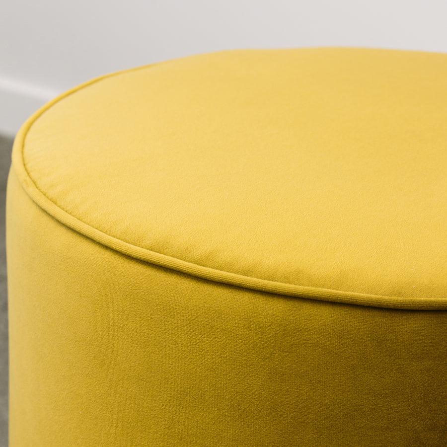 Small round ottoman in plush olive