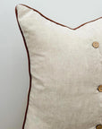 Linen cushion with piped edge in natural
