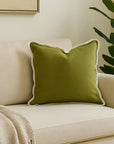 Velveteen scallop edge cushion in olive green