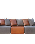 Vito modular sofa in loft charcoal and settler tapa leather