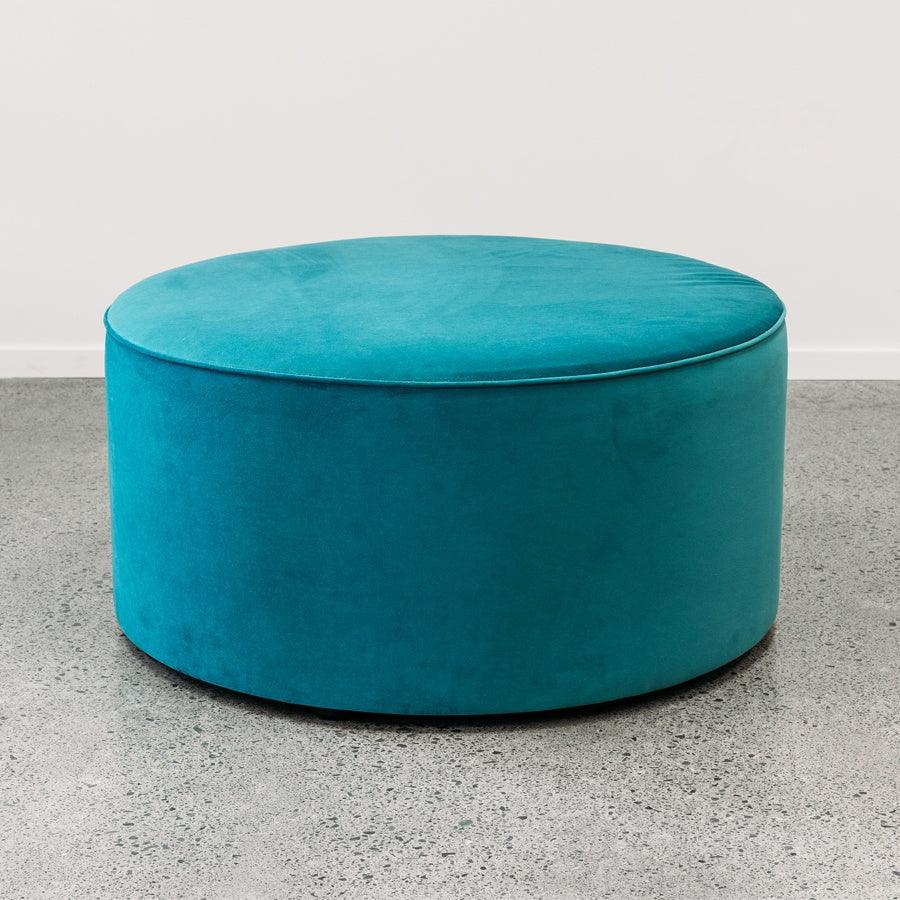 Large round ottoman in novara jungle