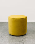 Small round ottoman in plush olive