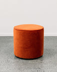 Small round ottoman in theodora paprika