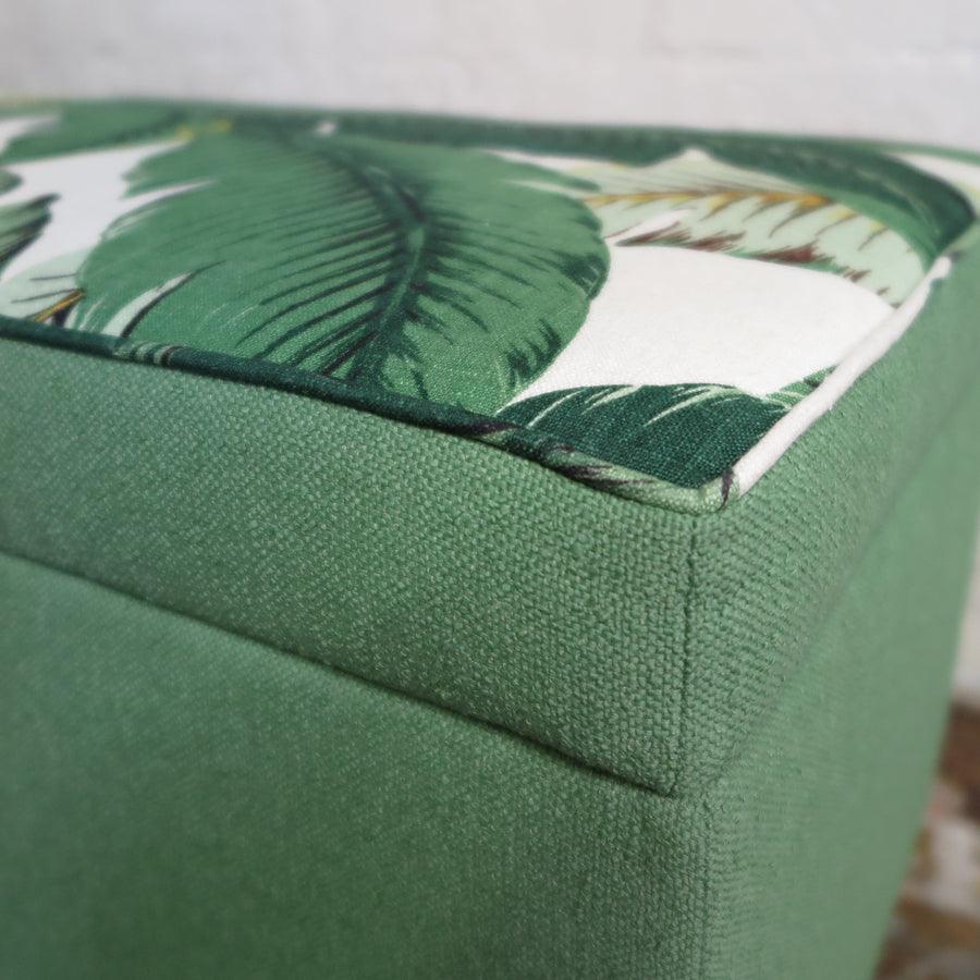 Storage ottoman in tropical palm and nassau forest