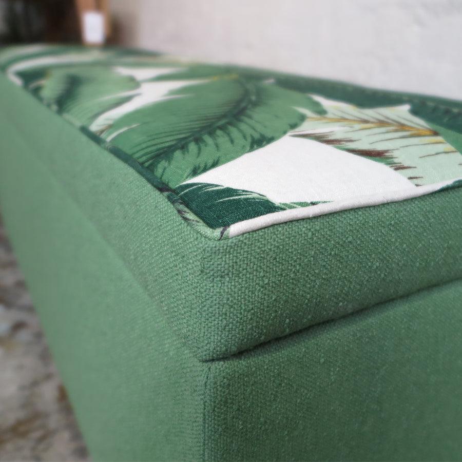 Storage ottoman in tropical palm and nassau forest