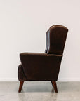 Lily winged leather armchair in settler serge