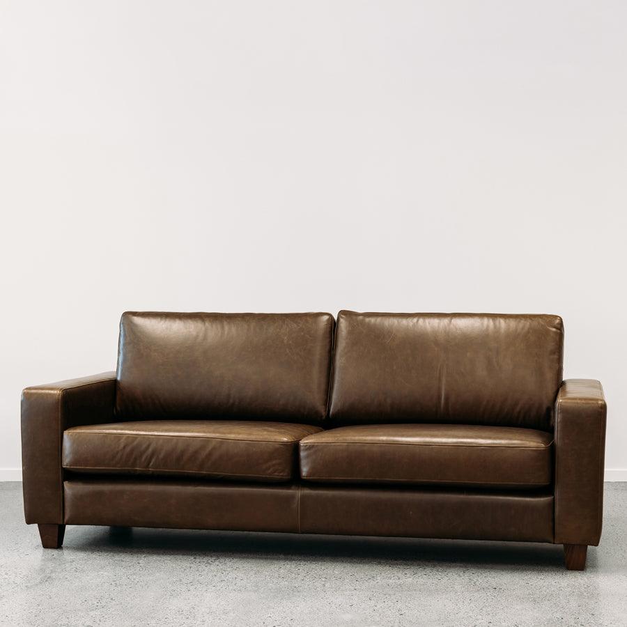 Coco leather sofa in greenstone monarch