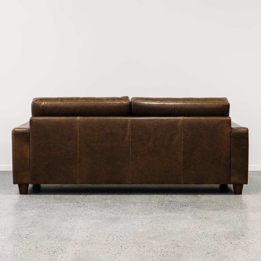 Coco leather sofa in greenstone monarch