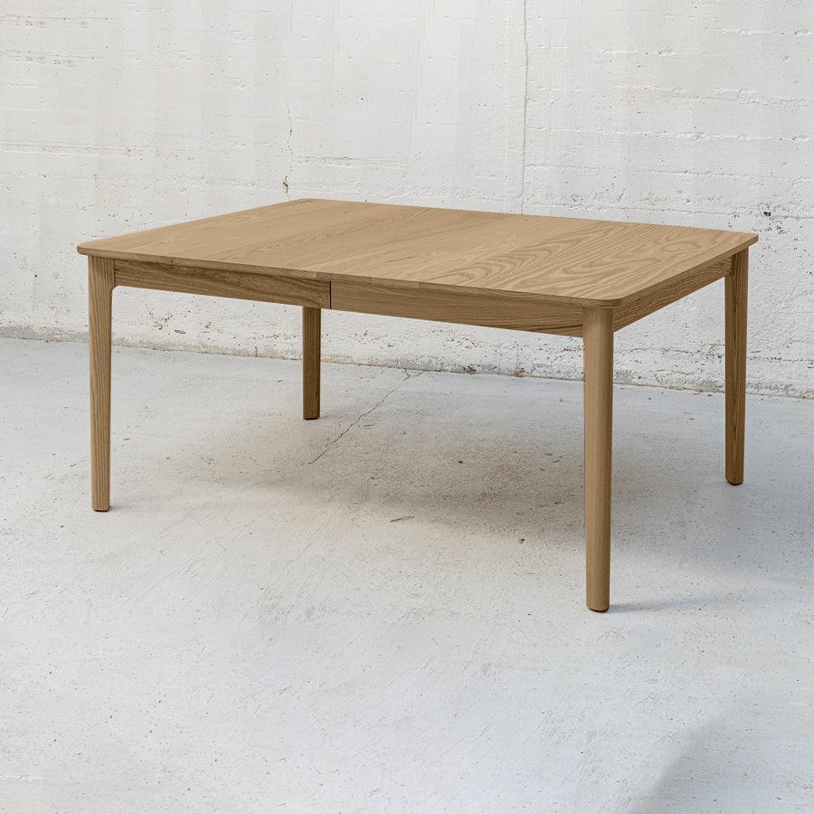 Ghost twin leaf extension table