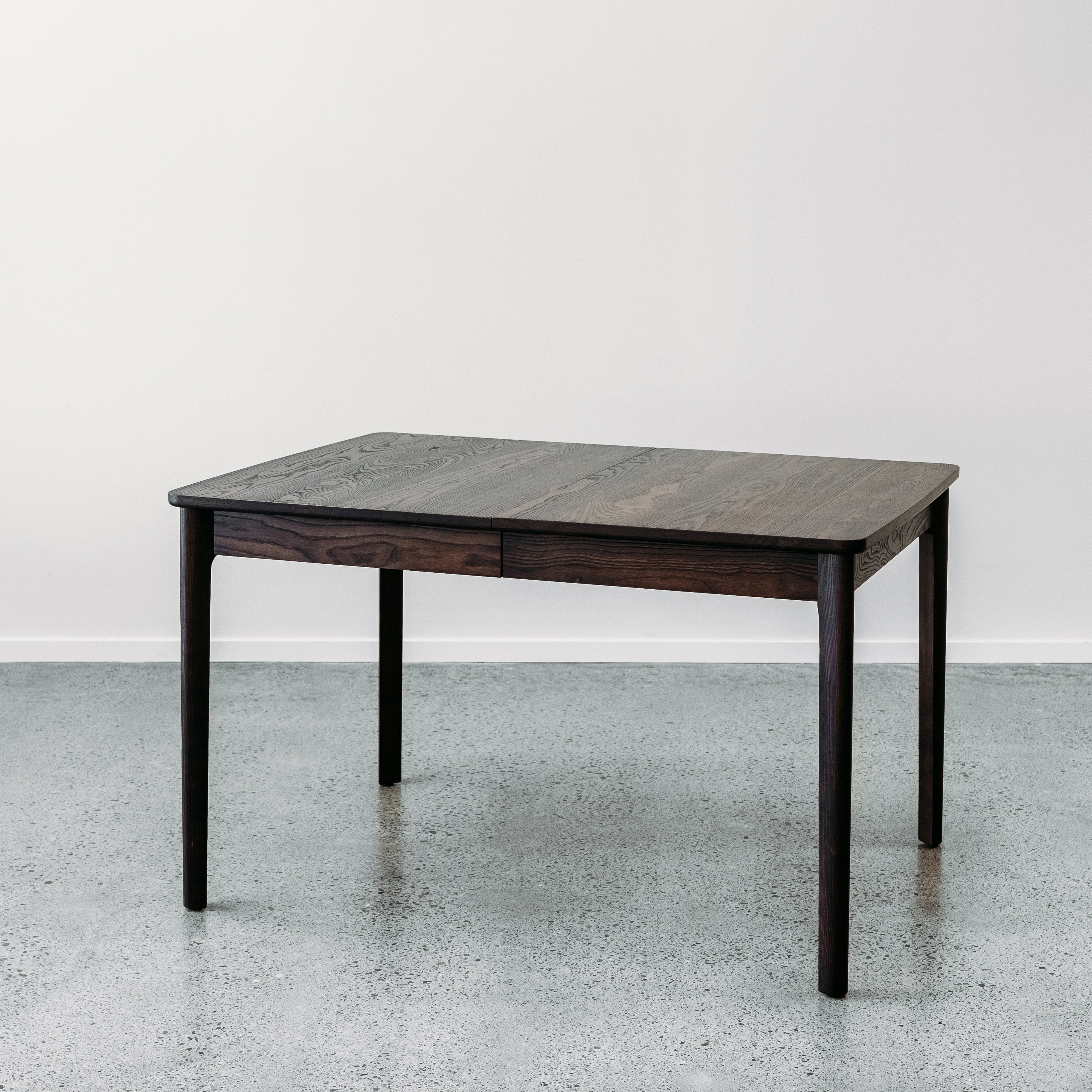 Ghost single leaf extension table