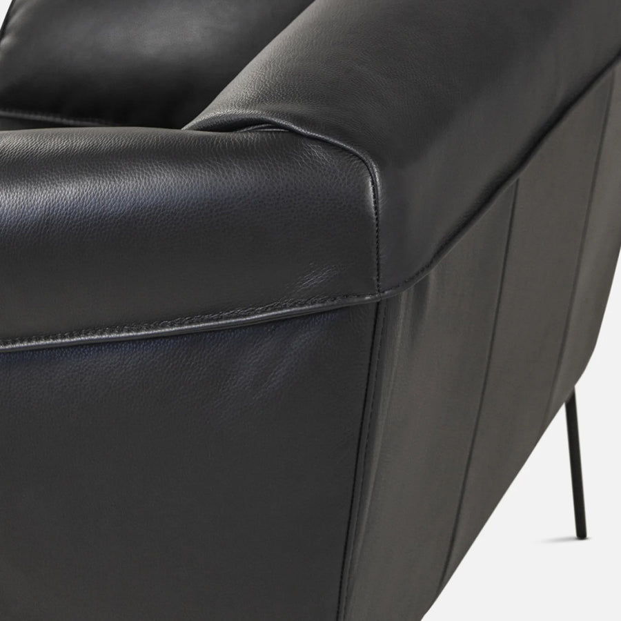 Saddle armchair in black leather