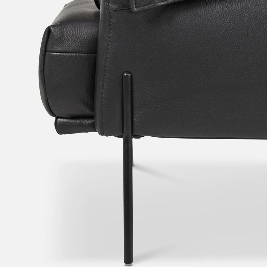 Saddle armchair in black leather