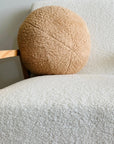 Plush round cushion in camel