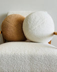 Plush round cushion in camel