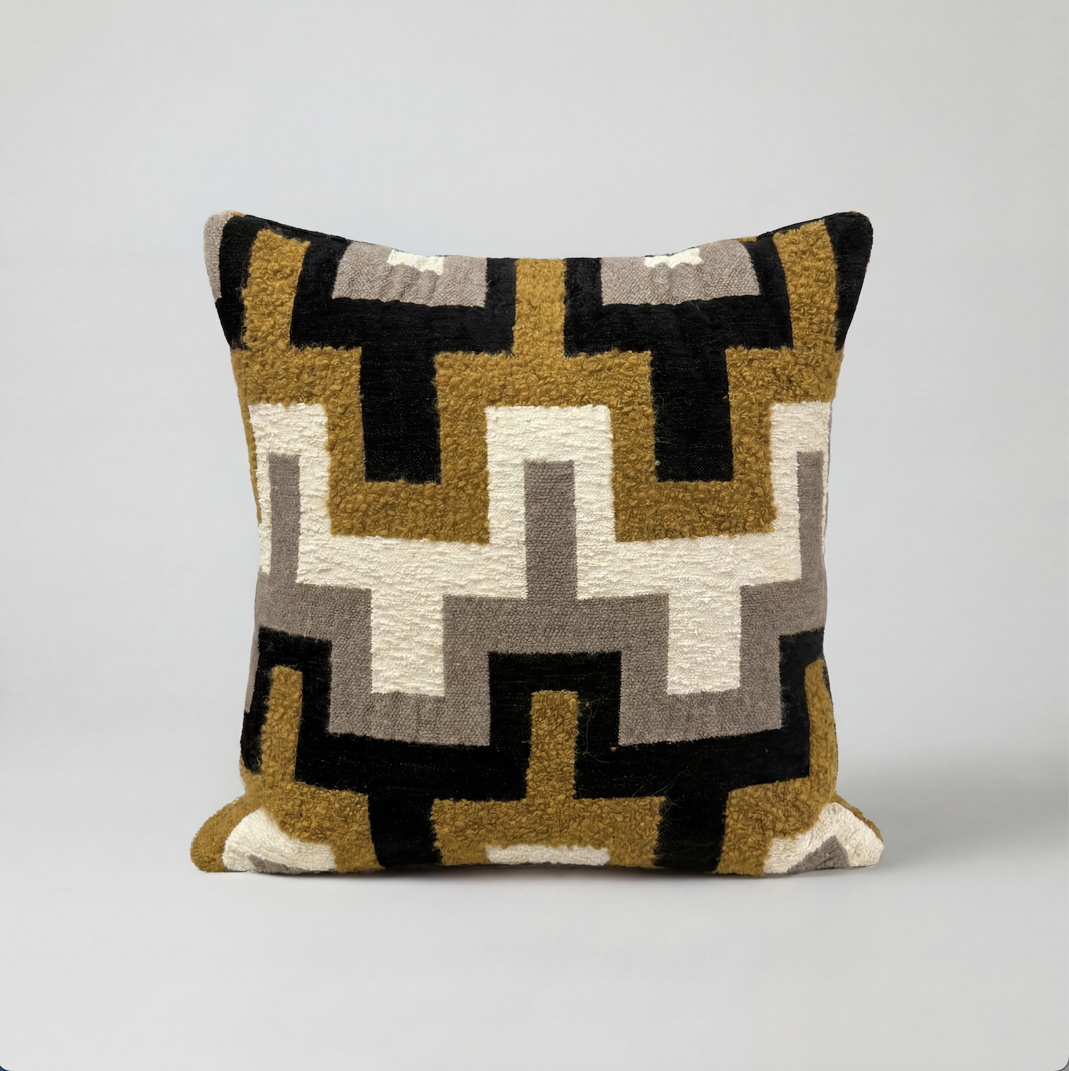Black and tan geo cushion
