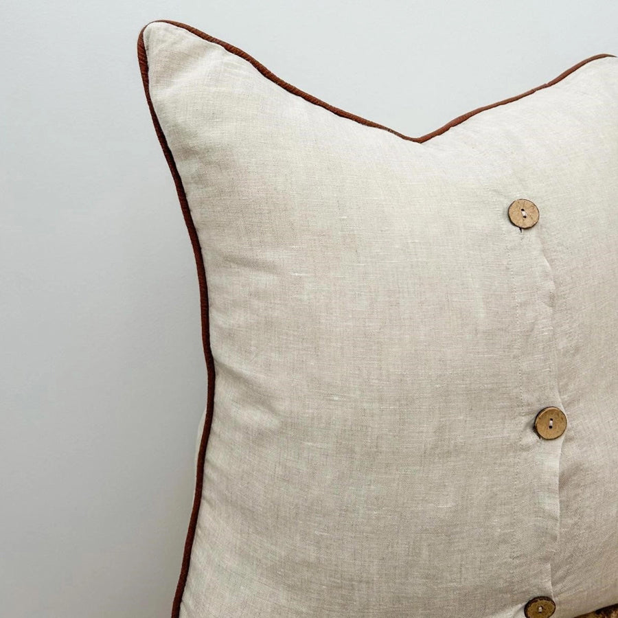 Linen cushion with piped edge in natural