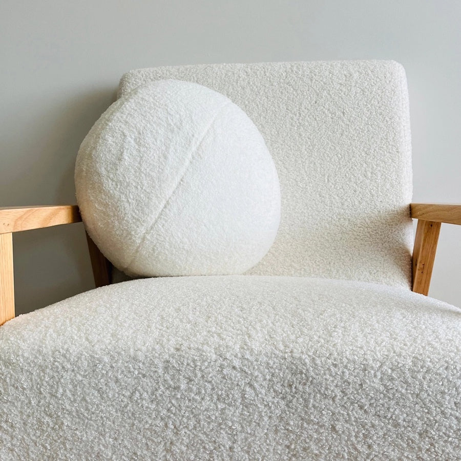 Plush round cushion in cream
