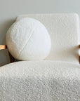 Plush round cushion in cream