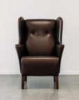 Lily winged leather armchair in settler serge