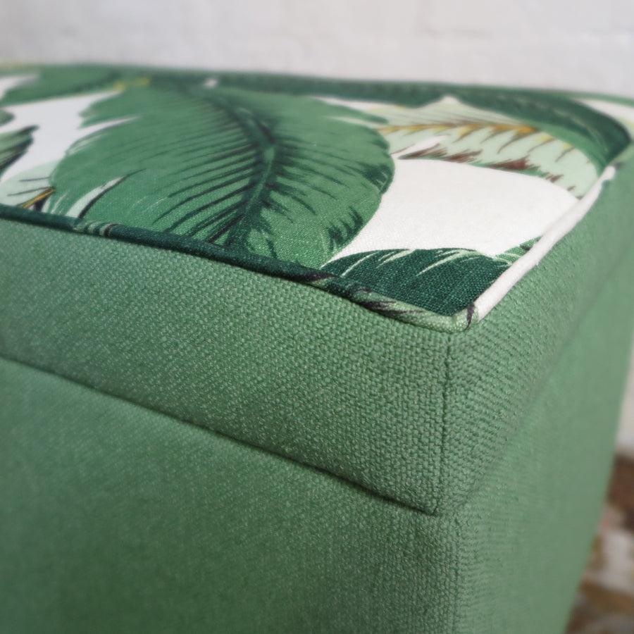 Storage ottoman in tropical palm and nassau forest
