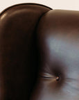 Lily winged leather armchair in settler serge